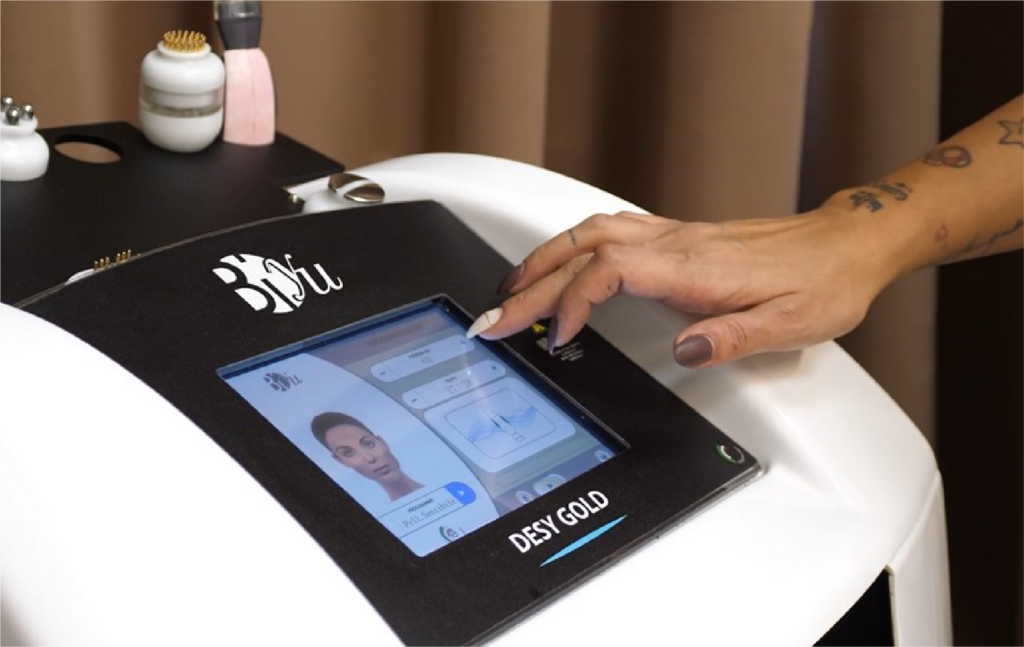 female worker setting up skin treatment technology